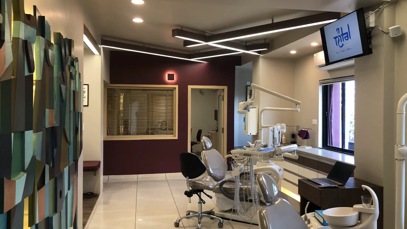 The dental operatory, with the clinic artwork on the wall