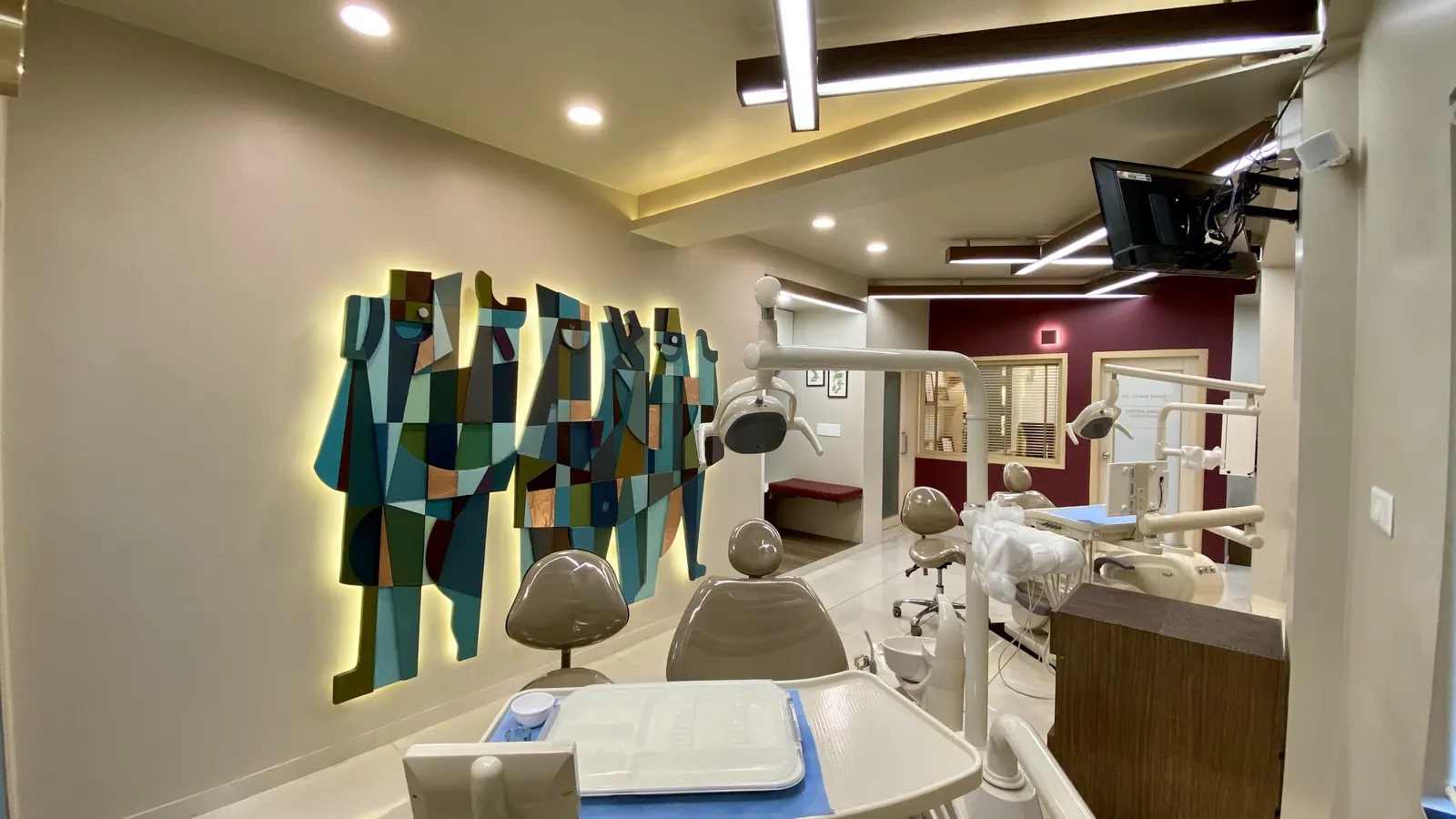 A treatment chair beneath the commissioned wall artwork
